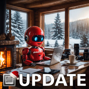 The cure IMatch robot having a good time working on a laptop while sitting next to warm fire, and looking at a beautiful the winter landscape outside his windows.